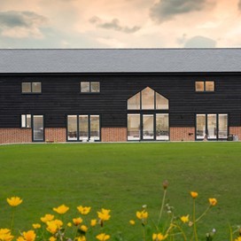 Beautiful Barn Conversion aided with classical Origin Bi-folds and Windows.