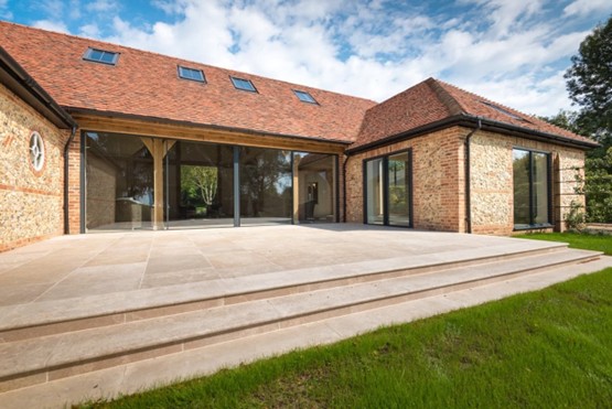 4 panel glass siding door leading onto patio