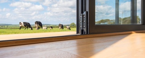 Low angle shot of a origin threshhold with Bifold door open