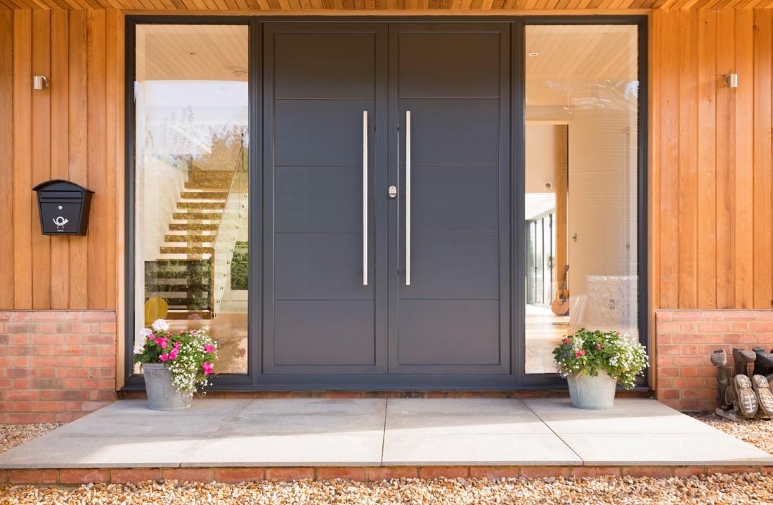 Front view of a black door with glass panels