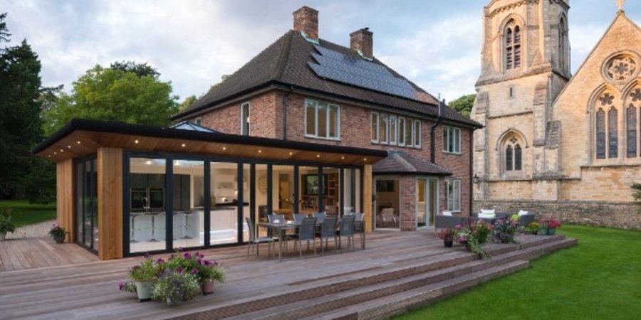 Kitchen extension with bi-fold doors which open on to a large patio.