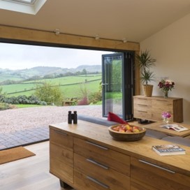 The view from within the Barton Barn extension out through Origin's fully opened doors