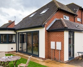 A large bay window from inside the kitchen of the recently renovated property