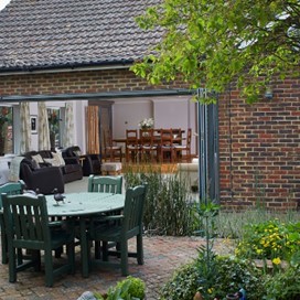 The view from the garden into a property with different types of patio doors