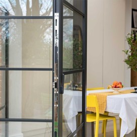 A close up view of a set of black Origin Bifold doors