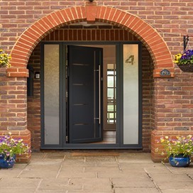 Slightly open Origin front door view from the front of the house