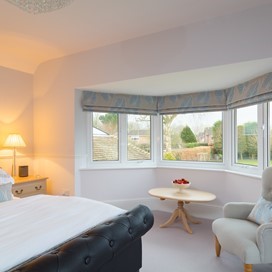 A close up of a bay window in a bedroom