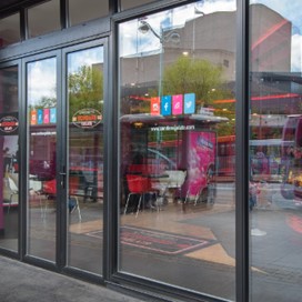A close up of the shopfront windows of a Plymouth ice cream parlour