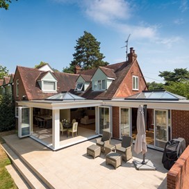 Outdoor view of a whole house with white extension attached