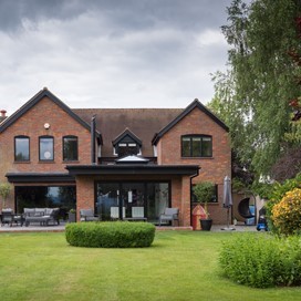 Origin OB-72 Bi-fold Doors, OW-70 Windows and OS-20 Sliding Doors Complete this Cosy Family Home