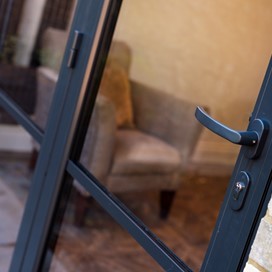 Outside of bifold door looking down on the black handle