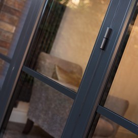 Outside of bifold door looking down on the black handle