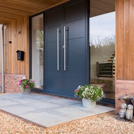 Front door of barn conversion, large black front door