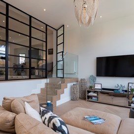 Origin Internal doors transform this living space, improving sound separation and warmth. 