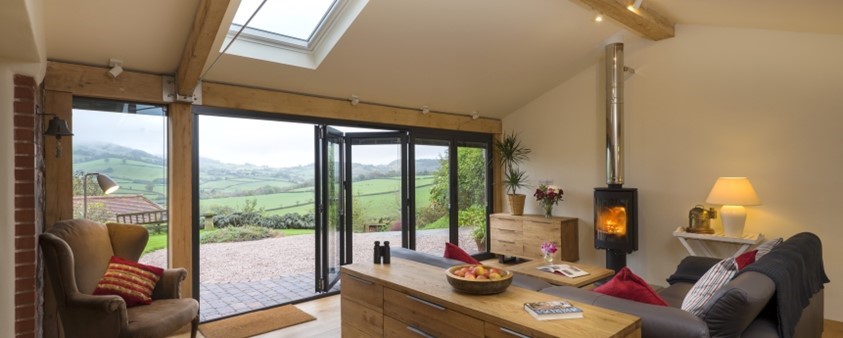 Origin's doors partly opened, seen from inside the Barton Barn extension