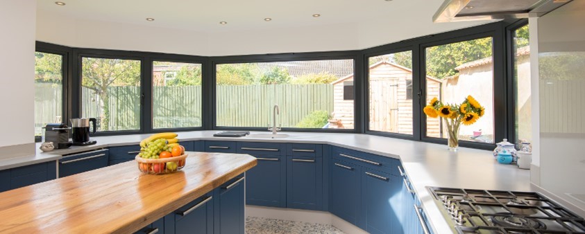 A large bay window from inside the kitchen of the recently renovated property