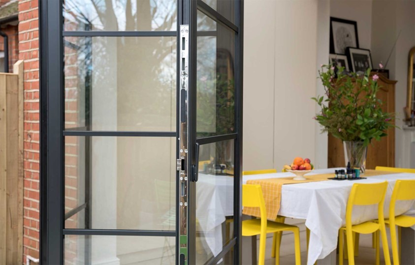 A close up view of a set of black Origin Bifold doors