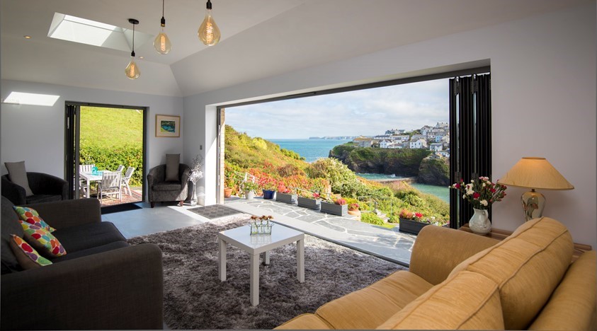 View from inside a dining room looking through open bifold doors