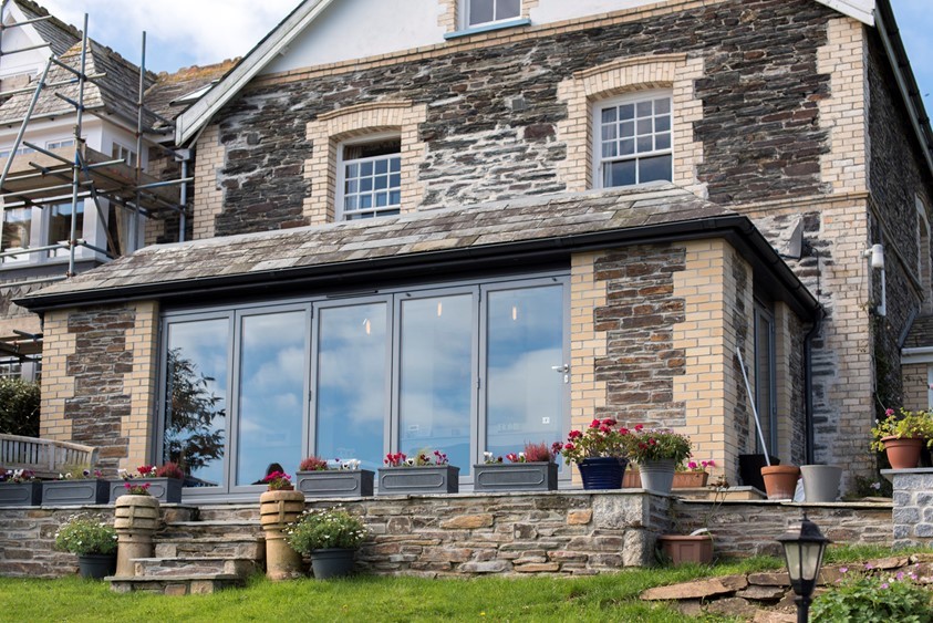 Outside of a modern home fitted with closed bifold doors