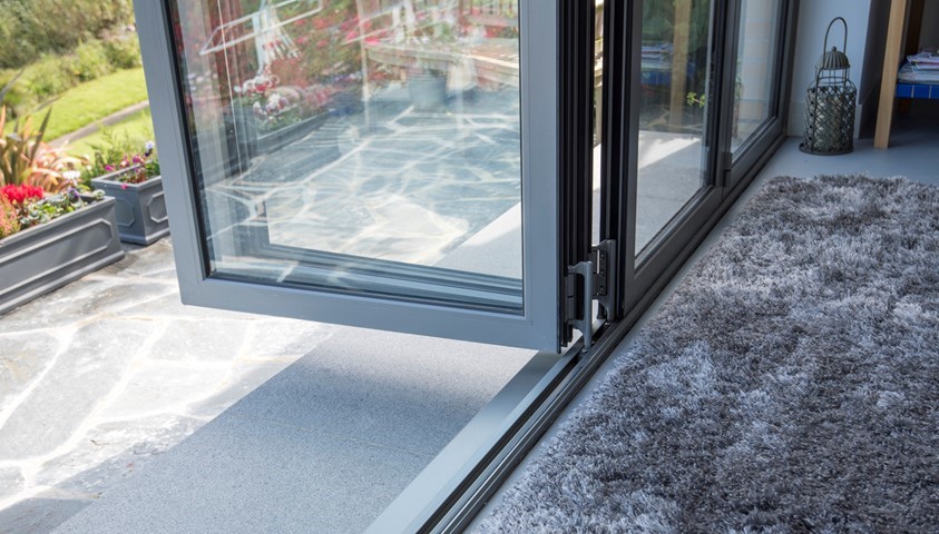 Looking towards the bottom of an open set of bifold doors, with the track visible