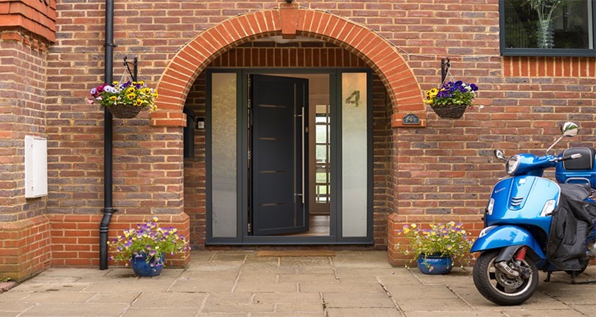 Slightly open Origin front door view from the front of the house