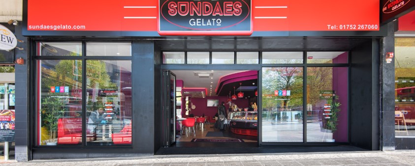 An exterior shot of Sundaes Gelato showing the storefront windows and doors supplied by Origin