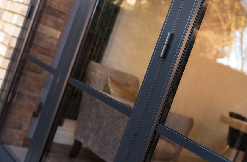 Outside of bifold door looking down on the black handle
