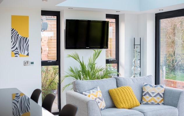 A new lease of life given to this orangery, with a hint of yellow, styled kitchen extension by multi-functional Jet Black Origin products. 