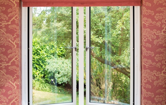 Outdoor view of a whole house with white extension attached