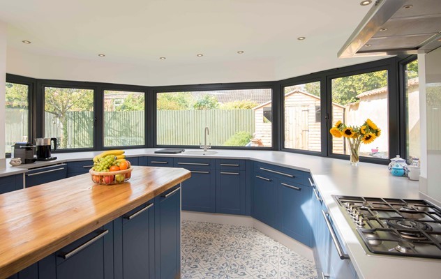 A large bay window from inside the kitchen of the recently renovated property