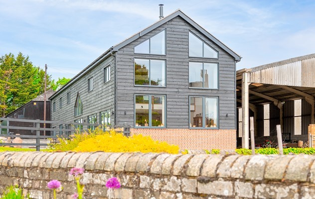 Beautiful Barn Conversion aided with classical Origin Bi-folds and Windows.
