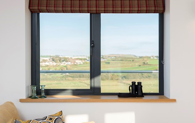 Origin products deck out this modern country home, letting light flood in and perfectly framing the surrounding views. 