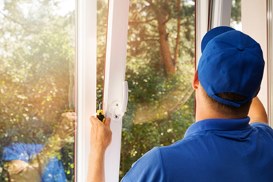 Tradesperson repairing/replacing an Origin window.