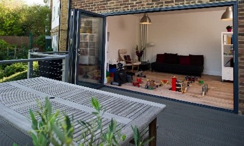 Bi-fold patio doors - Opened up to a patio and a garden.