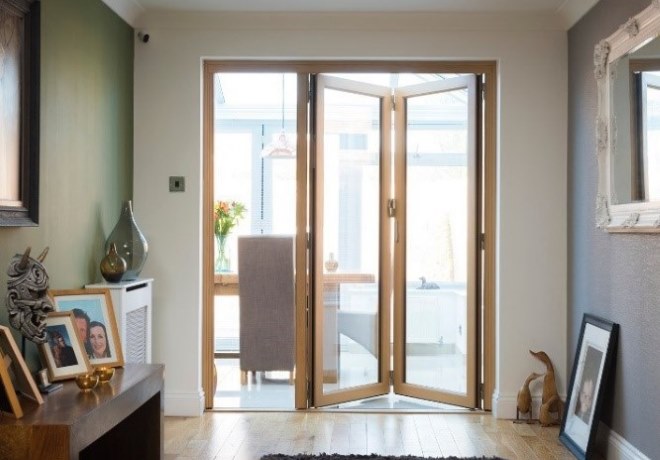 Bifold doors open in a dining room