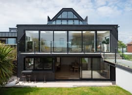 Spacious Holiday Home captures a beautiful view of the sea through Origin Sliding Doors
