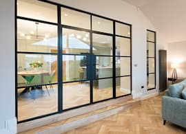 Origin Black Internal Aluminium Doors fit seamlessly as a partition wall between living area and kitchen