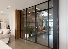 An experienced commercial and residential interior designer, partitioned his property with Black Grey Internal Doors